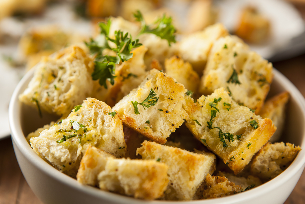 Bowl of croutons with herbs