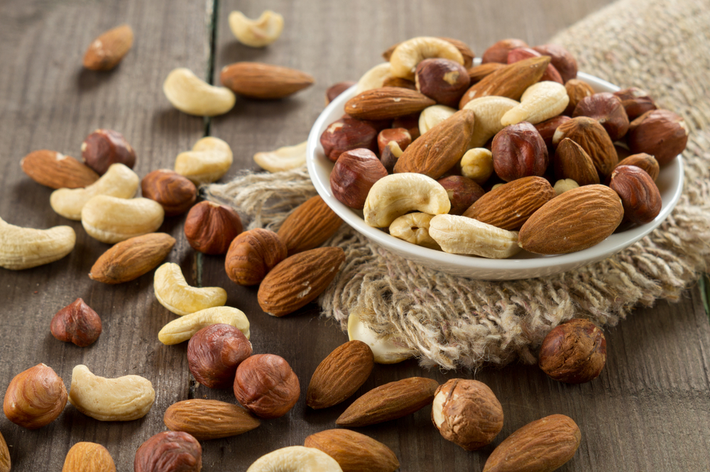 Bowl of mixed nuts on table